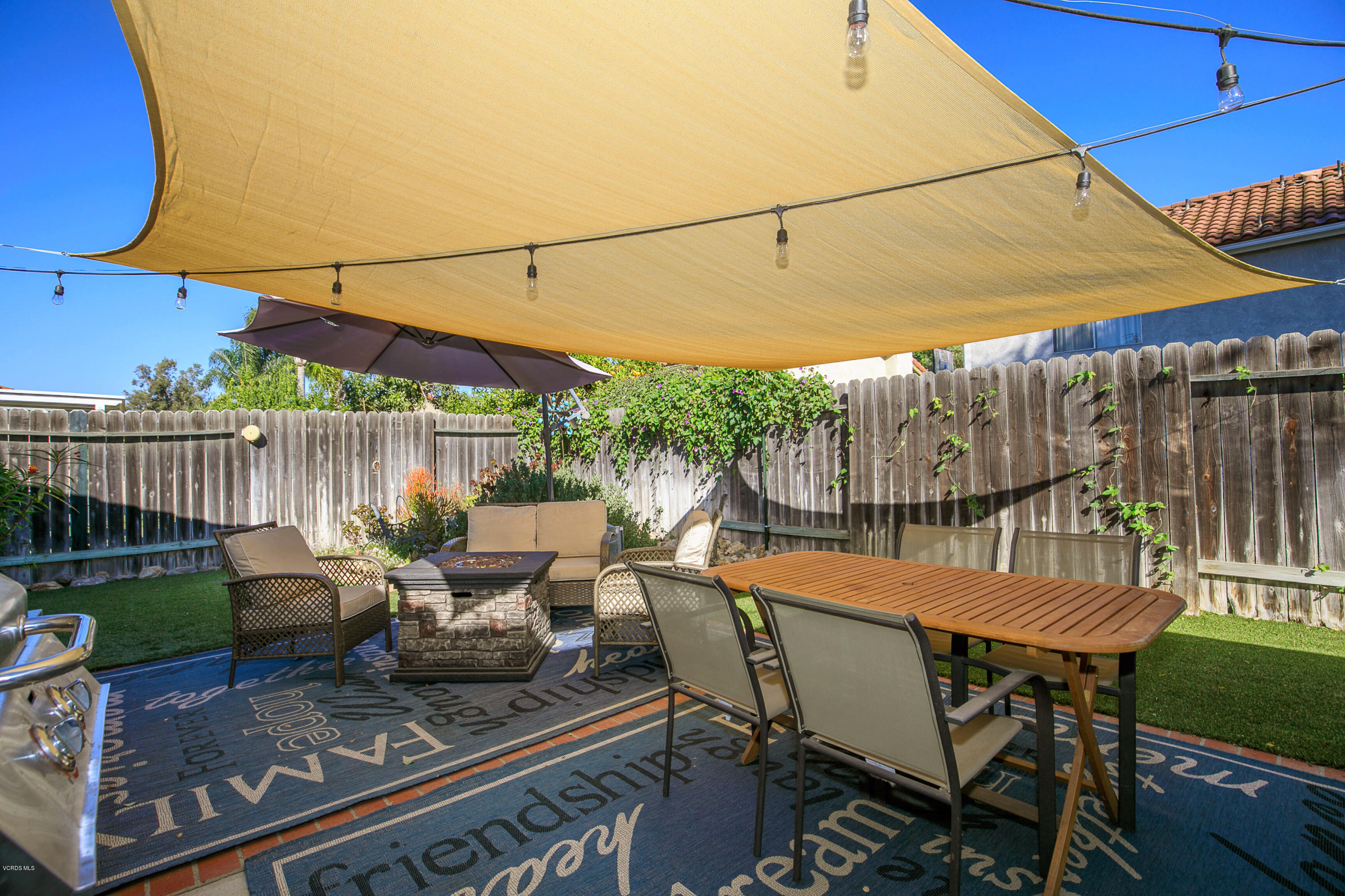 4722 Avedon Road Moorpark, CA 93021 - Photo 31 of 38 a patio with glass top table and chairs