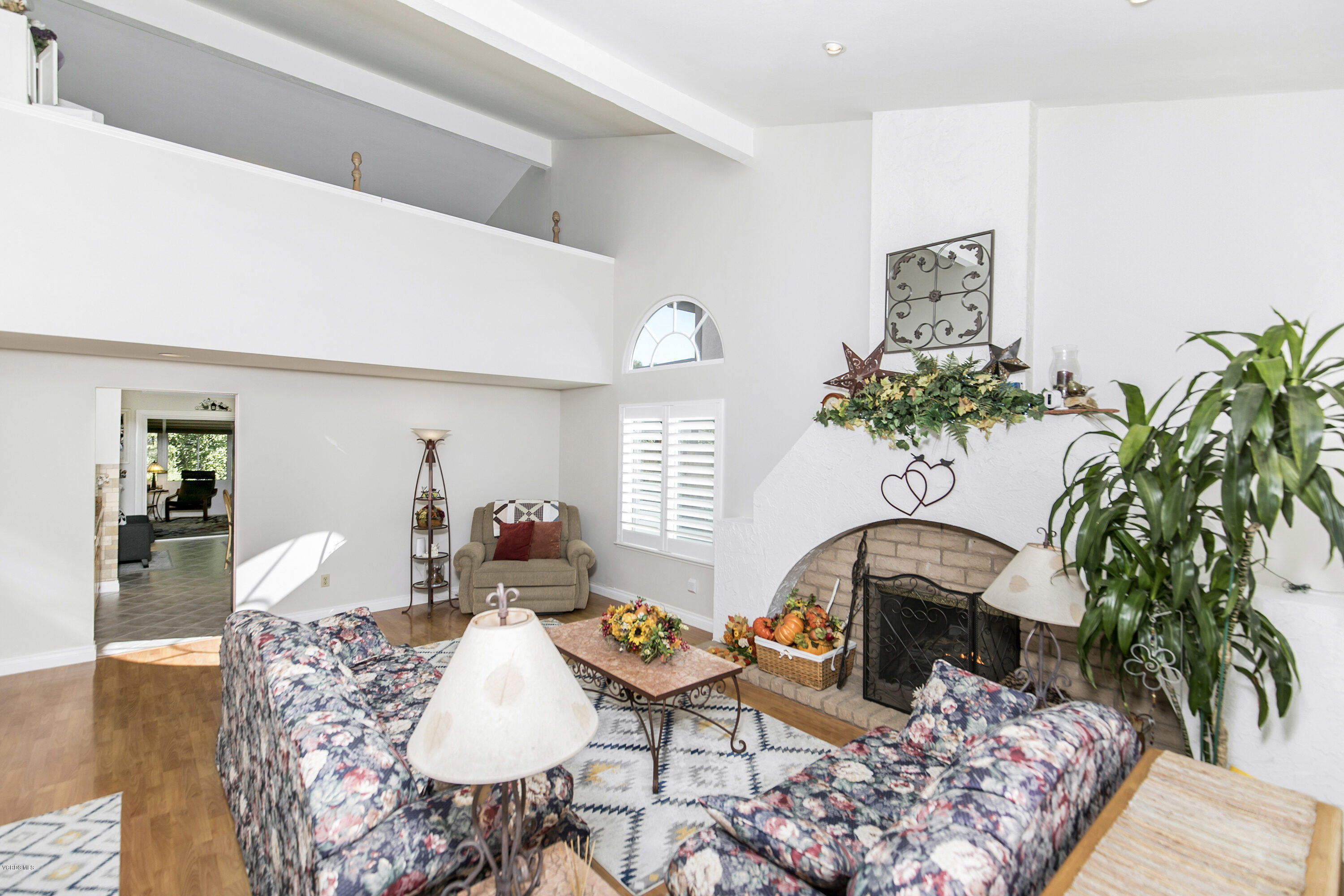 4722 Avedon Road Moorpark, CA 93021 - Photo 7 of 38 a living room with furniture flowerpot and wooden floor