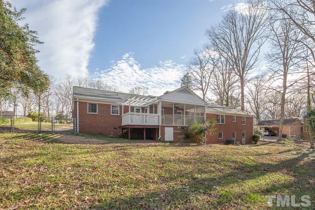8913 Hunting Trail Raleigh, NC 27613 - Photo 17 of 19 a view of a house with a yard
