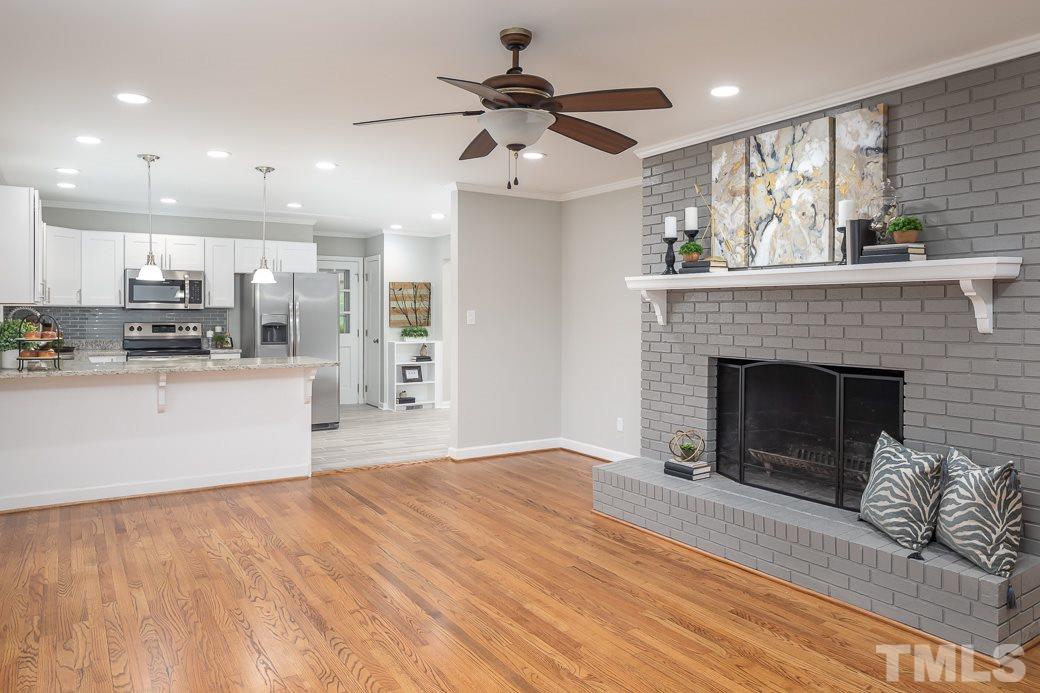 8913 Hunting Trail Raleigh, NC 27613 - Photo 19 of 19 a view of kitchen with cabinets and wooden floor