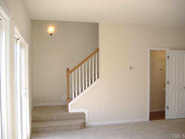 8304 Pilots View Drive, Unit 24 Raleigh, NC 27617 - Photo 8 of 10 Open stair rail with sconce lighting
