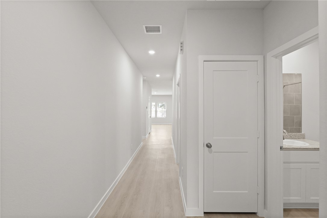4414 Albritton Avenue Bryan, TX 77801 - Photo 3 of 30 a view of a hallway with wooden floor