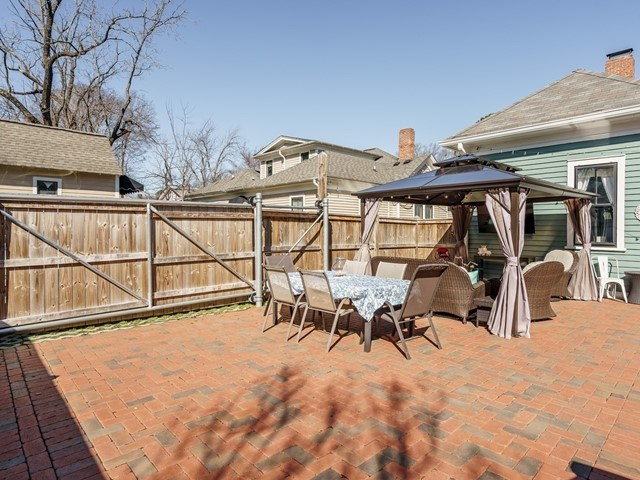 518 East Lane Street Raleigh, NC 27601 - Photo 19 of 29 A new custom rolling gate provides parking options in addition to a private parking space outside the fence at the top of the driveway.