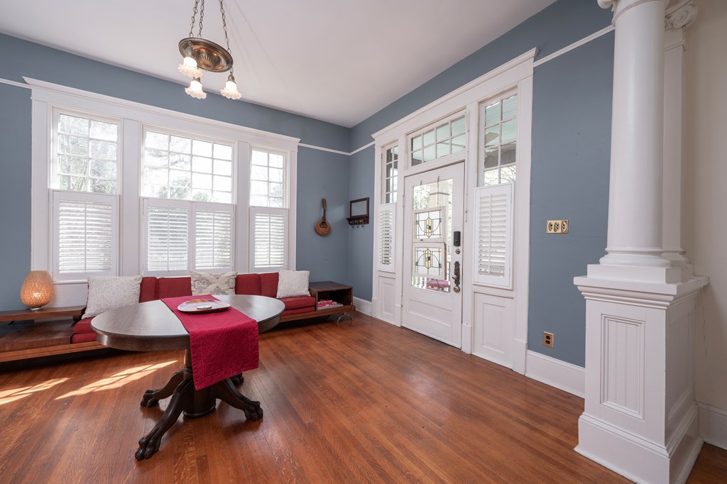 215 7th Street Columbus, GA 31901 - Photo 12 of 64 a living room with furniture floor to ceiling window and wooden floor