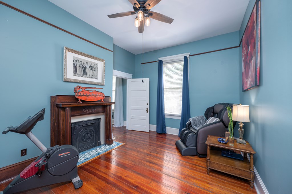 215 7th Street Columbus, GA 31901 - Photo 32 of 64 a living room with furniture and a fireplace