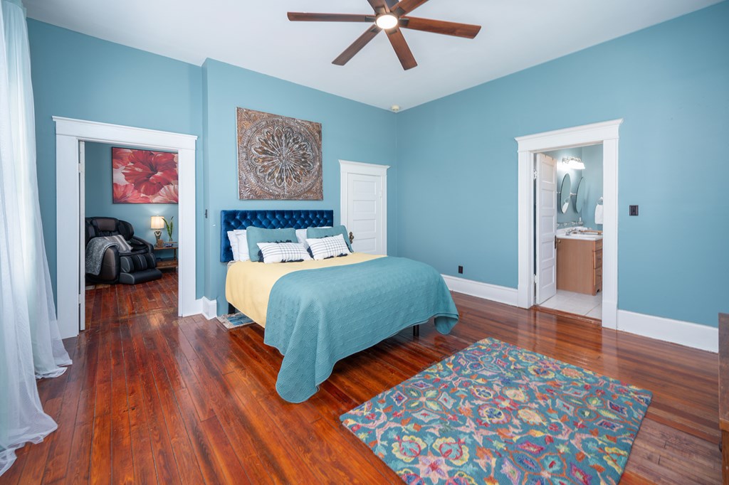 215 7th Street Columbus, GA 31901 - Photo 33 of 64 a bedroom with a bed and wooden floor