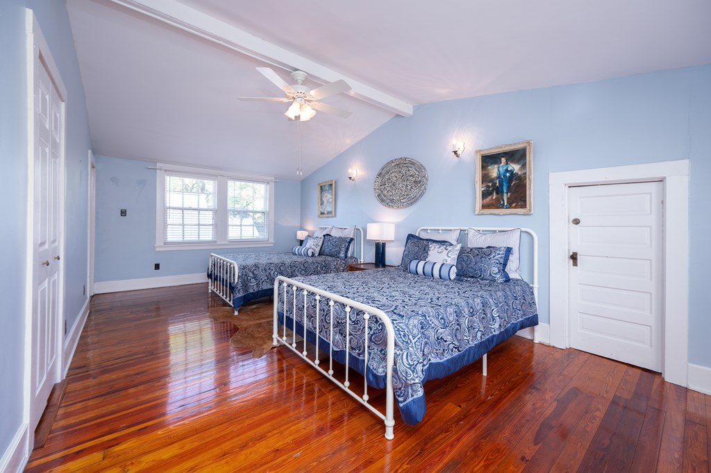215 7th Street Columbus, GA 31901 - Photo 38 of 64 a bedroom with a bed and wooden floor