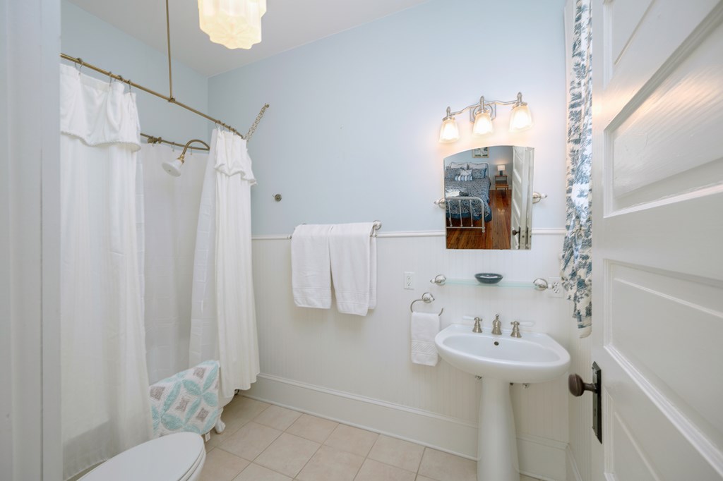 215 7th Street Columbus, GA 31901 - Photo 39 of 64 a bathroom with a sink a toilet and shower