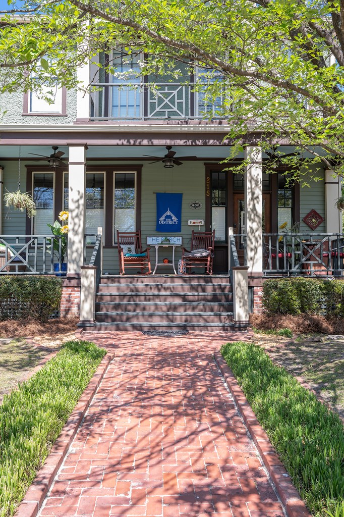 215 7th Street Columbus, GA 31901 - Photo 4 of 64 a front view of a building with outdoor seating