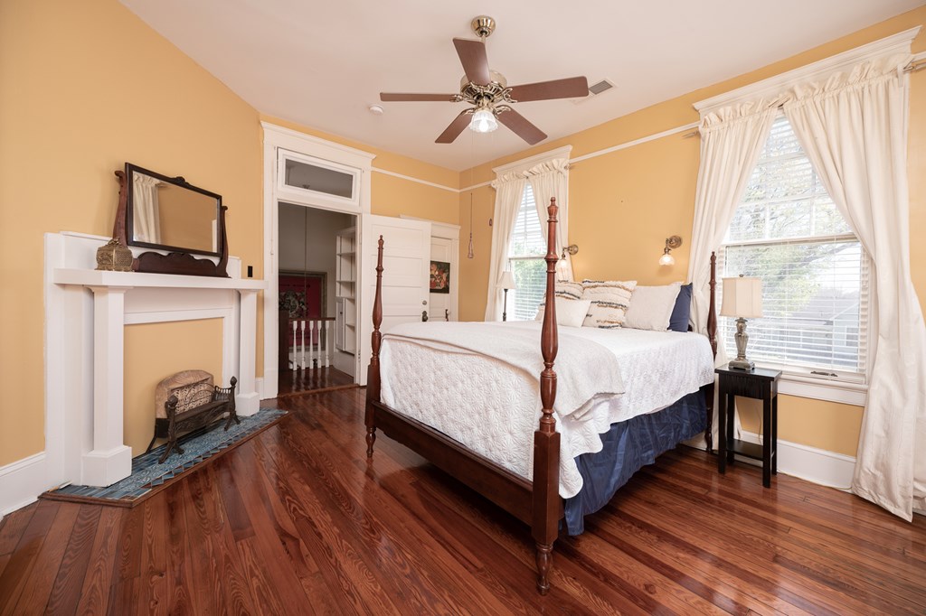 215 7th Street Columbus, GA 31901 - Photo 48 of 64 a bed room with a bed and a fireplace
