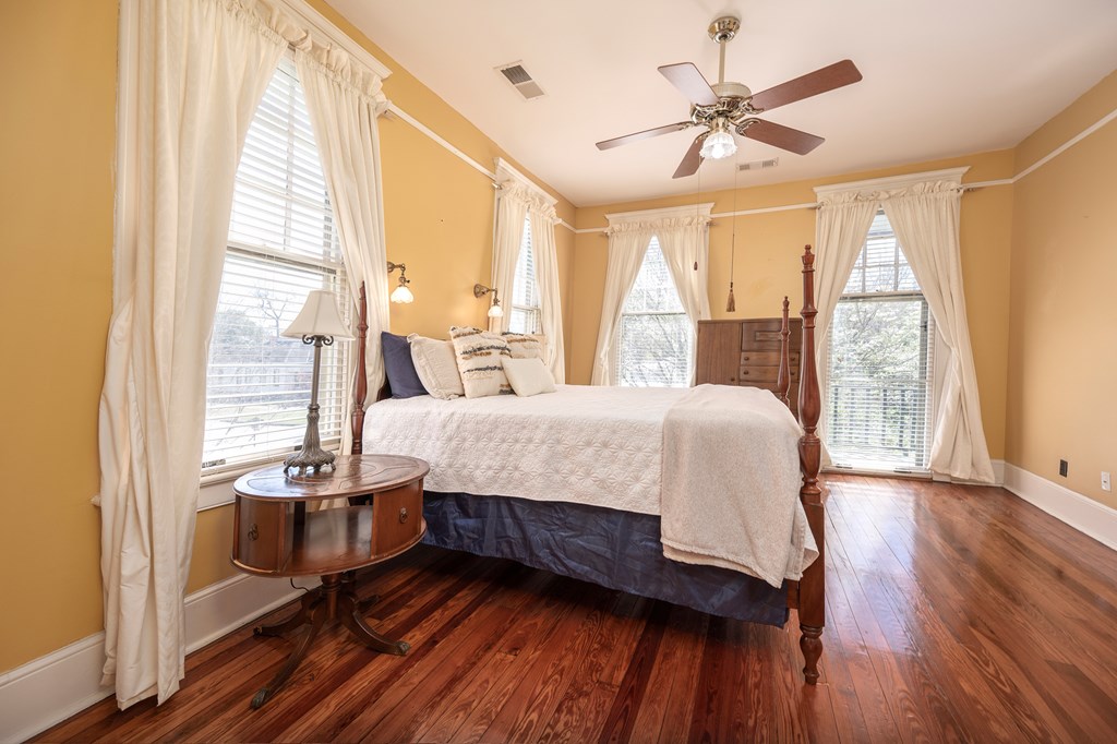 215 7th Street Columbus, GA 31901 - Photo 50 of 64 a spacious bedroom with a large bed and a large window with outer view