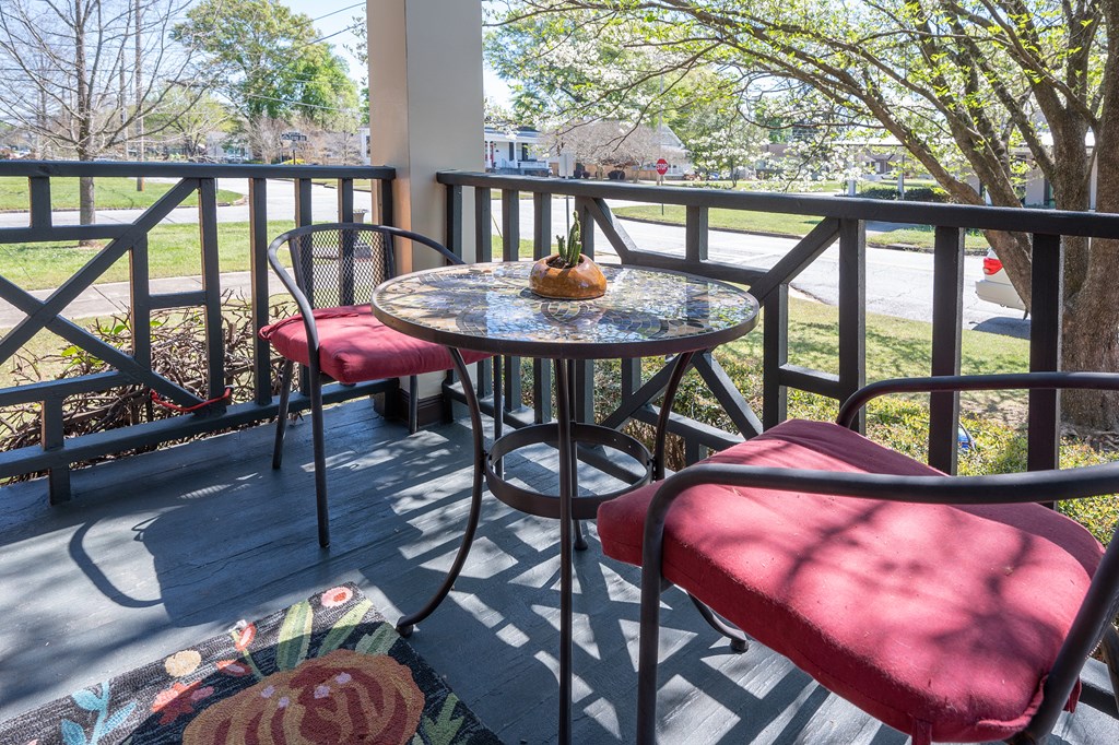 215 7th Street Columbus, GA 31901 - Photo 9 of 64 a balcony with table and chairs