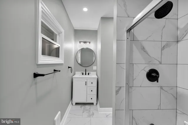 a bathroom with a sink and mirror