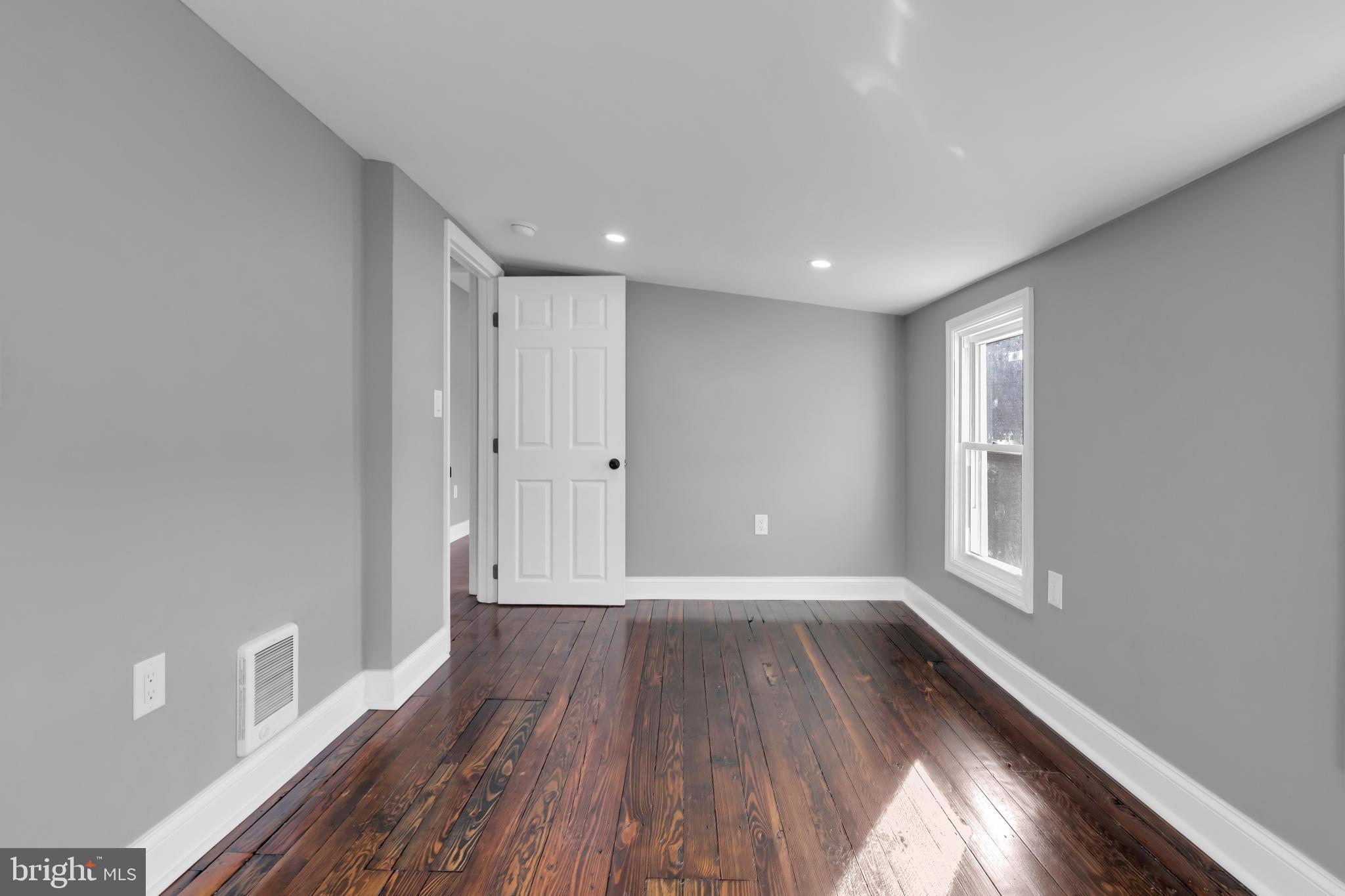 504 Pine Street Tamaqua, PA 18252 - Photo 19 of 27 a view of hallway with a large window and wooden floor