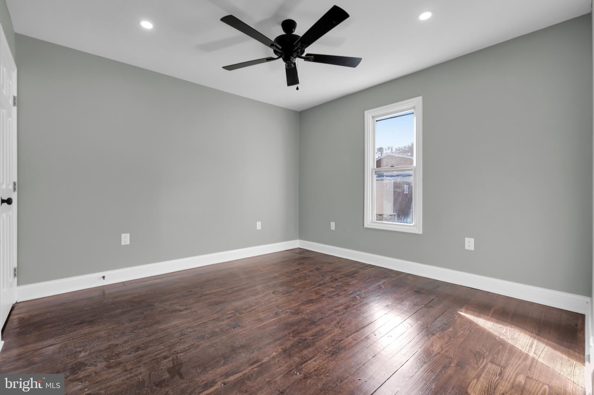 504 Pine Street Tamaqua, PA 18252 - Photo 20 of 27 an empty room with wooden floor and windows
