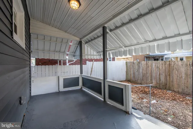 a view of an empty room with a fireplace
