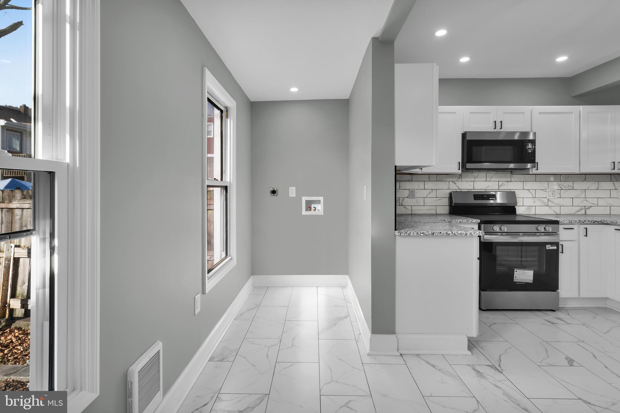 504 Pine Street Tamaqua, PA 18252 - Photo 7 of 27 a kitchen with stainless steel appliances granite countertop a refrigerator and a stove top oven