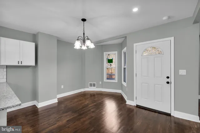 a view of a livingroom with wooden floor