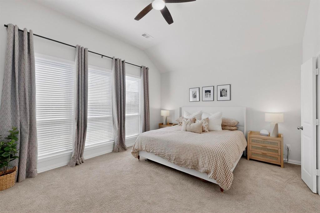 207 Buffalo Boulevard Rhome, TX 76078 - Photo 15 of 40 Fully vaulted and spacious primary bedroom with sitting area.