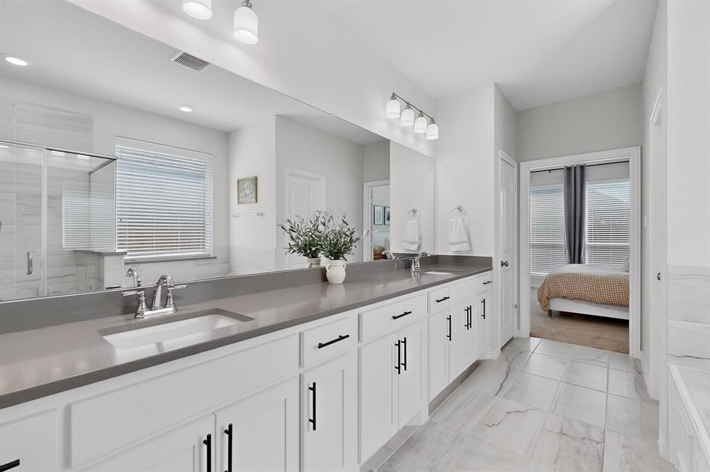 207 Buffalo Boulevard Rhome, TX 76078 - Photo 16 of 40 Crisp space and storage, just like a chic hotel.