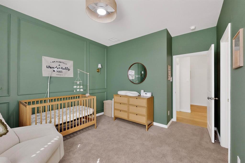 207 Buffalo Boulevard Rhome, TX 76078 - Photo 21 of 40 Currently a nursery with transitional ceiling fan, serving every age.