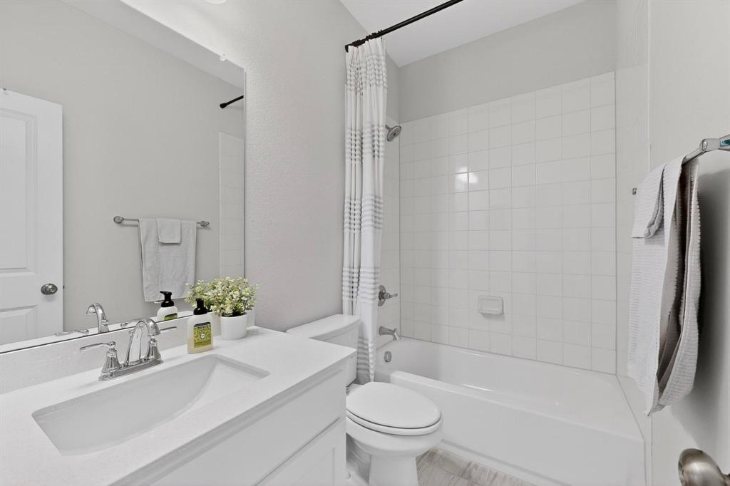 207 Buffalo Boulevard Rhome, TX 76078 - Photo 23 of 40 Tiled to the ceiling, the sparkle keeps this room inviting.