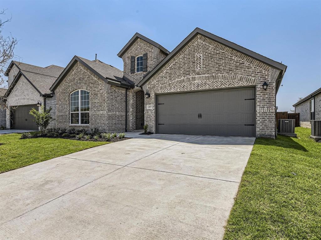207 Buffalo Boulevard Rhome, TX 76078 - Photo 3 of 40 French country home with full brick and timeless tones.