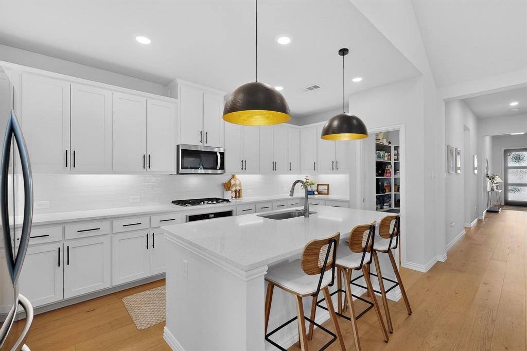 207 Buffalo Boulevard Rhome, TX 76078 - Photo 5 of 40 Just Wow! Light Oak Wood Floors showcase escort to the central gathering.