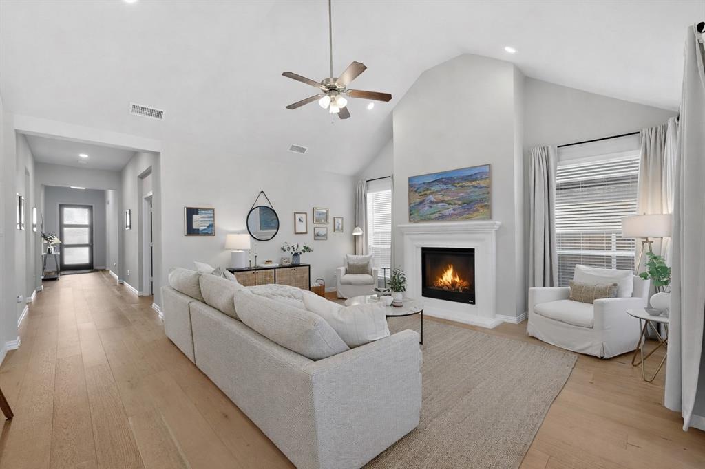 207 Buffalo Boulevard Rhome, TX 76078 - Photo 9 of 40 Peaceful gathering, with gas fireplace and flat TV focal points.