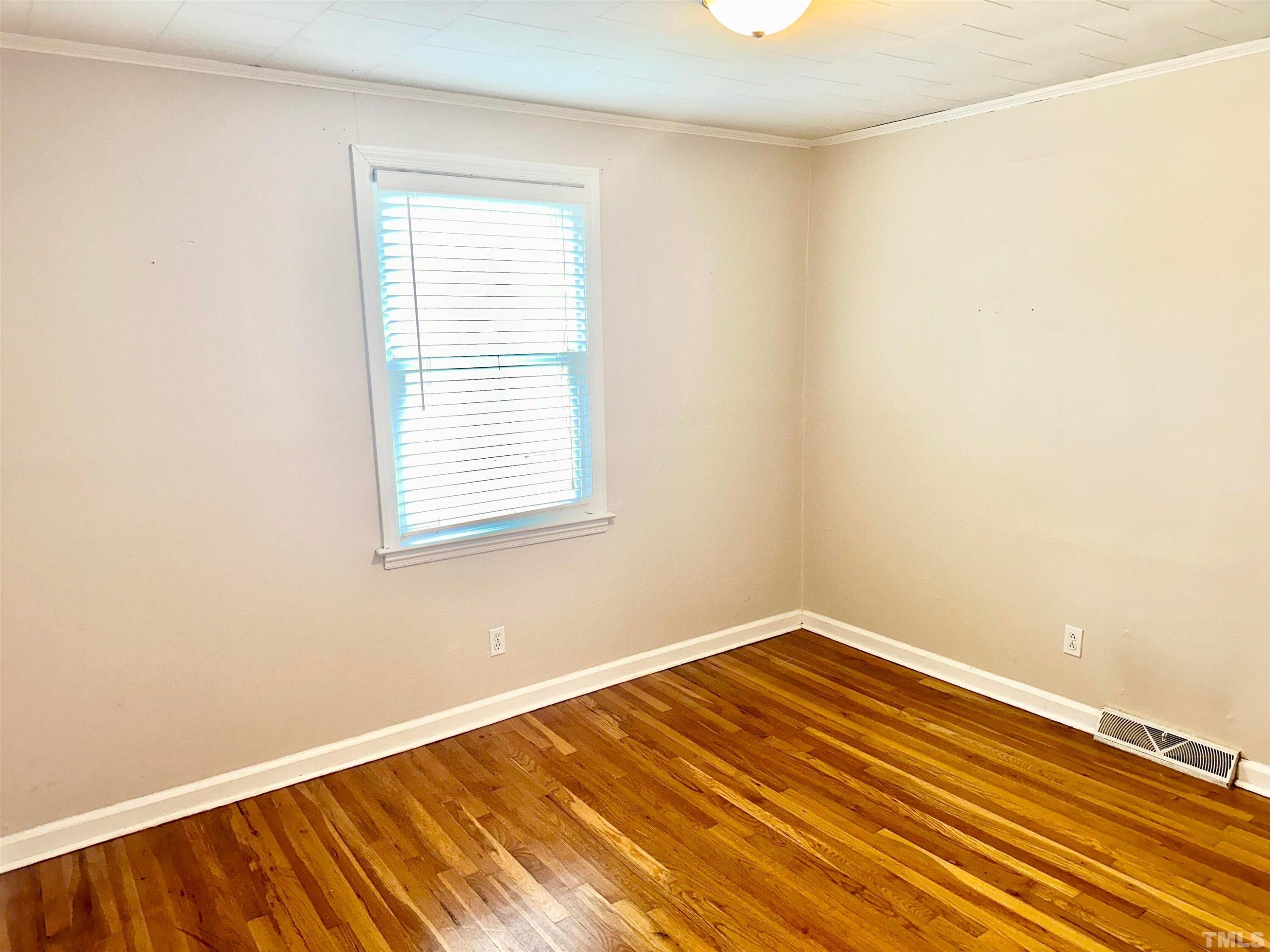 700 Mial Street Raleigh, NC 27608 - Photo 11 of 15 a view of a room with wooden floor and a window