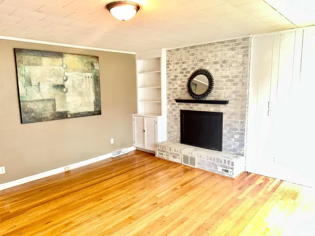 a bedroom with a bed and a fireplace