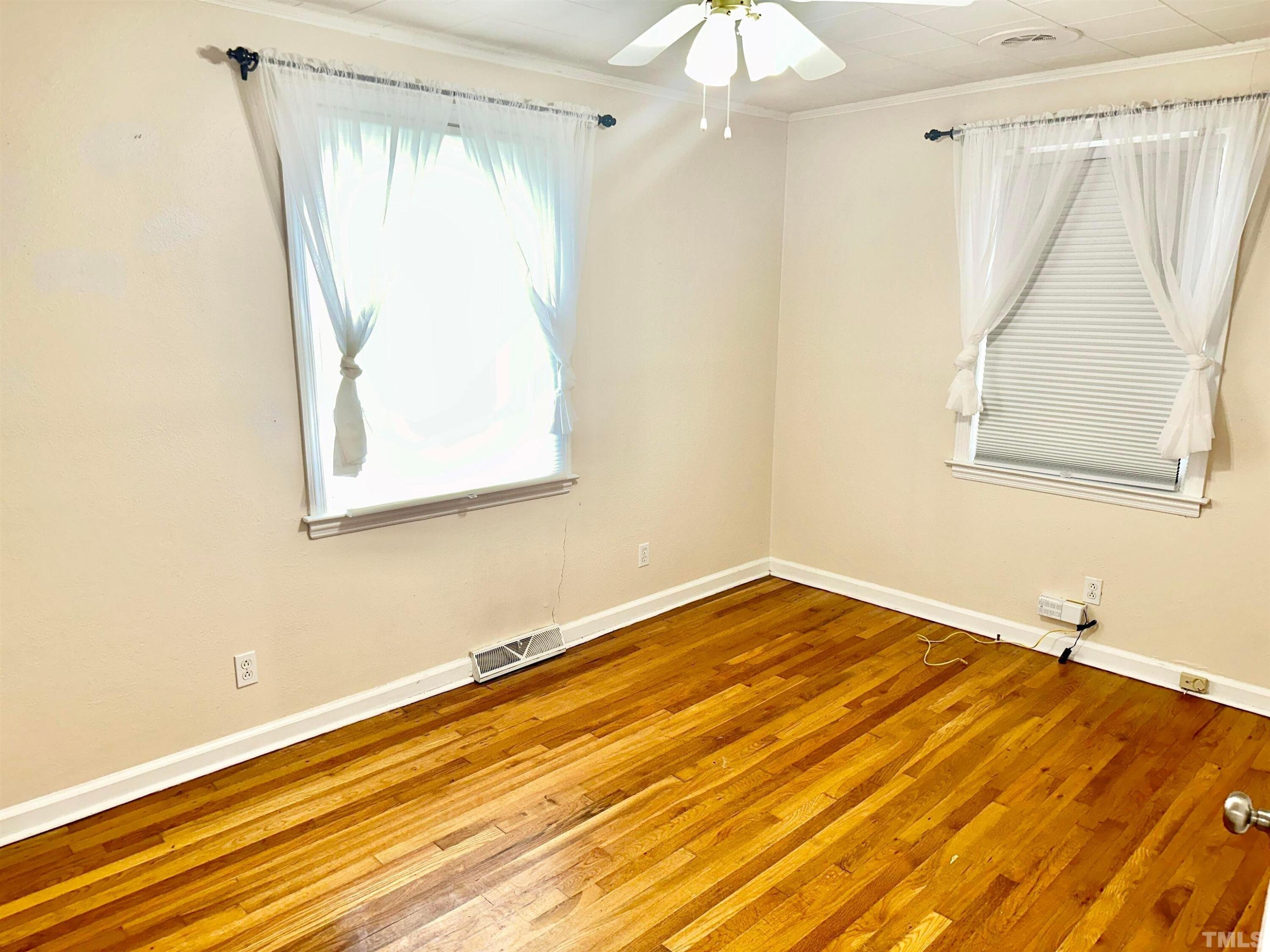 700 Mial Street Raleigh, NC 27608 - Photo 10 of 15 a view of a room with wooden floor and white walls