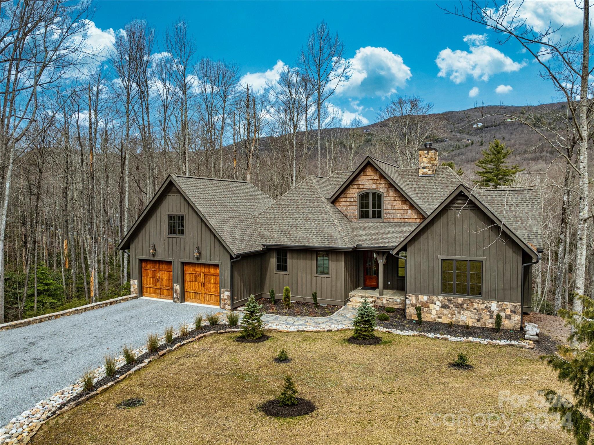 510 Boiling Springs Road Sapphire, NC 28774 - Photo 2 of 48 a view of a house with entertaining space