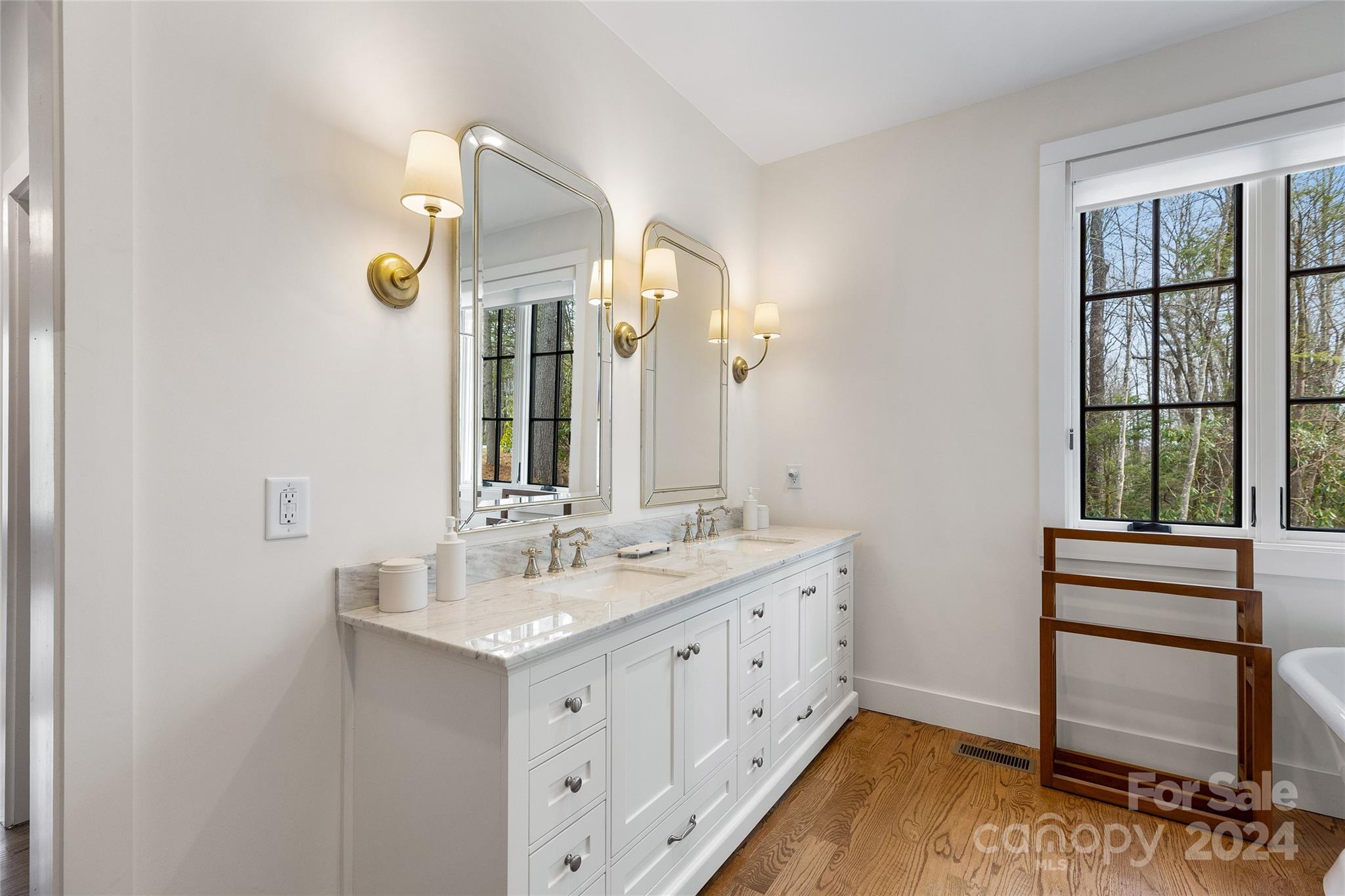 510 Boiling Springs Road Sapphire, NC 28774 - Photo 25 of 48 a bathroom with a sink and a mirror