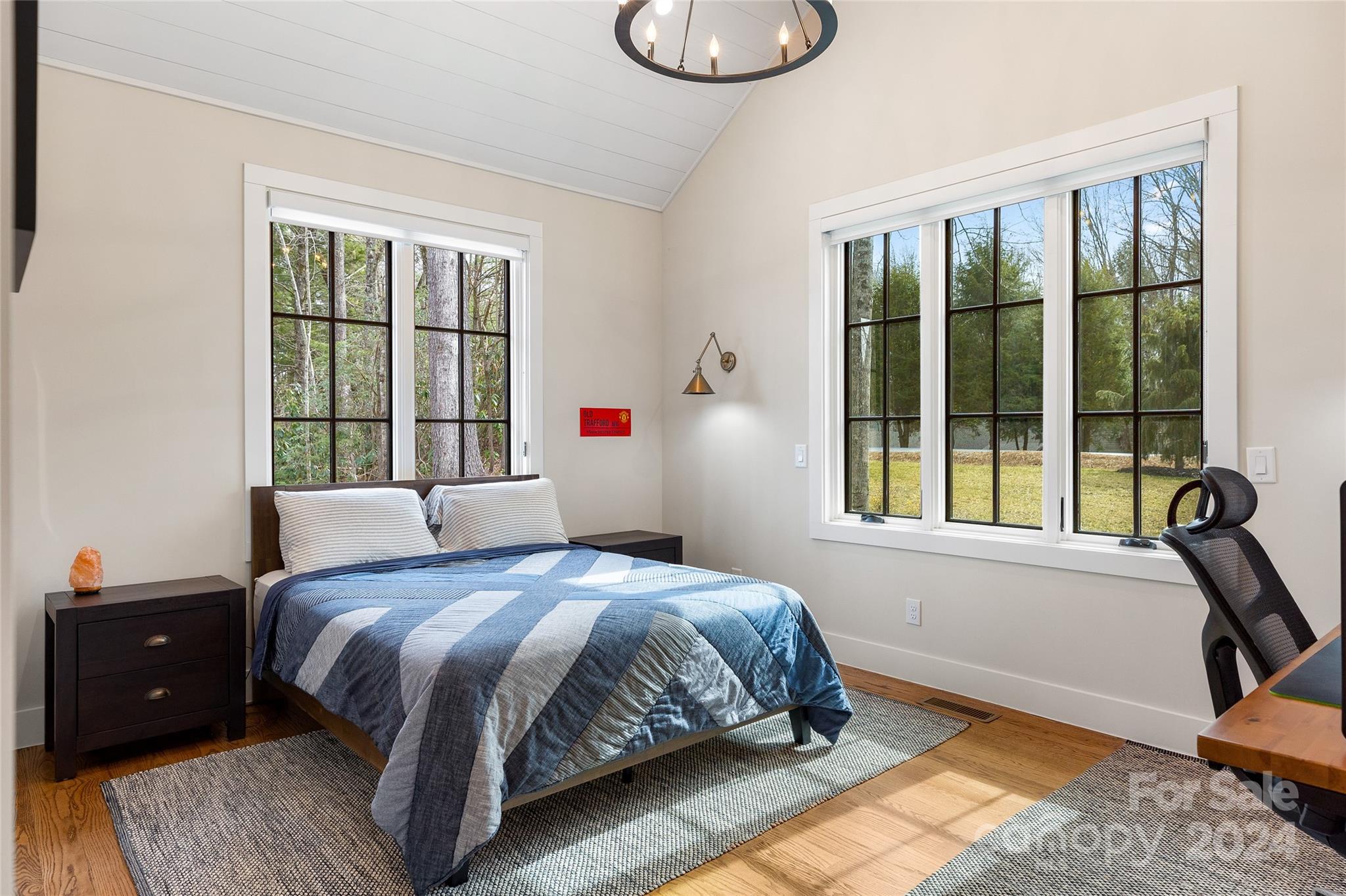 510 Boiling Springs Road Sapphire, NC 28774 - Photo 29 of 48 a bedroom with a bed and a window