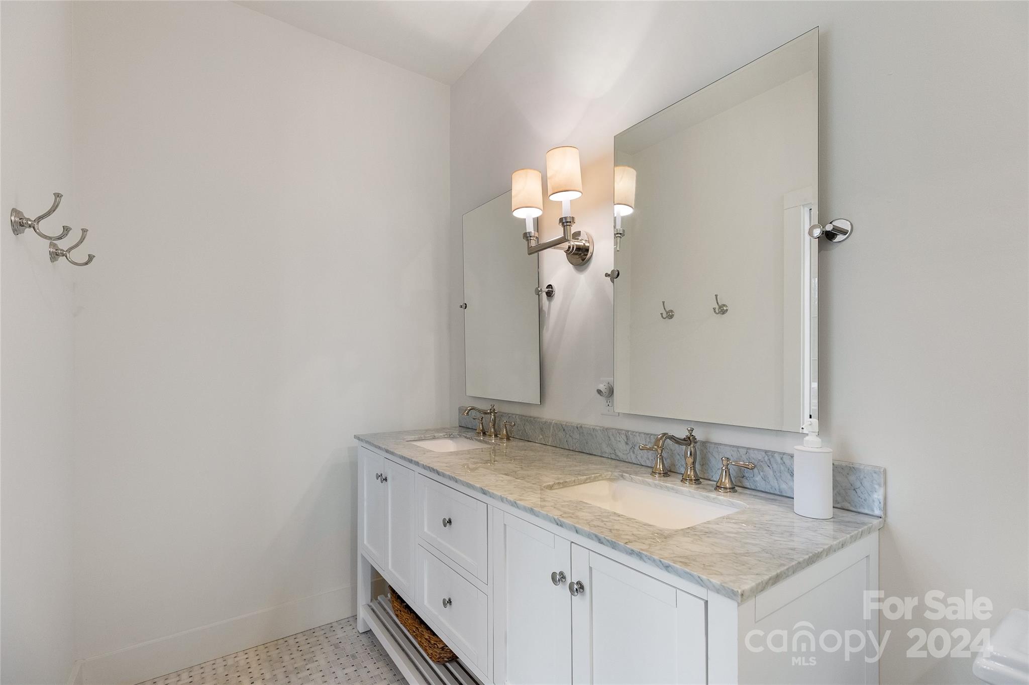 510 Boiling Springs Road Sapphire, NC 28774 - Photo 32 of 48 a bathroom with a granite countertop sink and a mirror