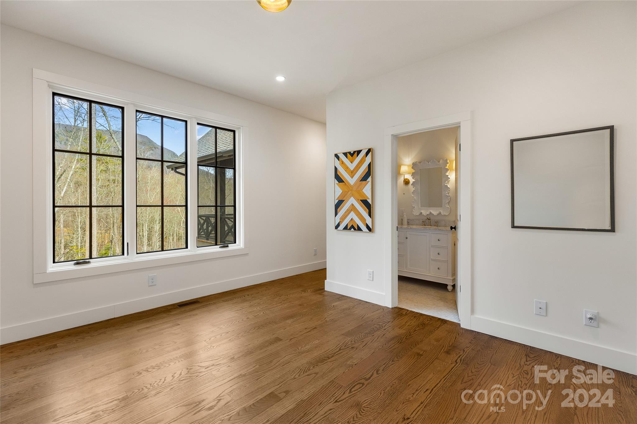 510 Boiling Springs Road Sapphire, NC 28774 - Photo 35 of 48 wooden floor in an empty room with a window