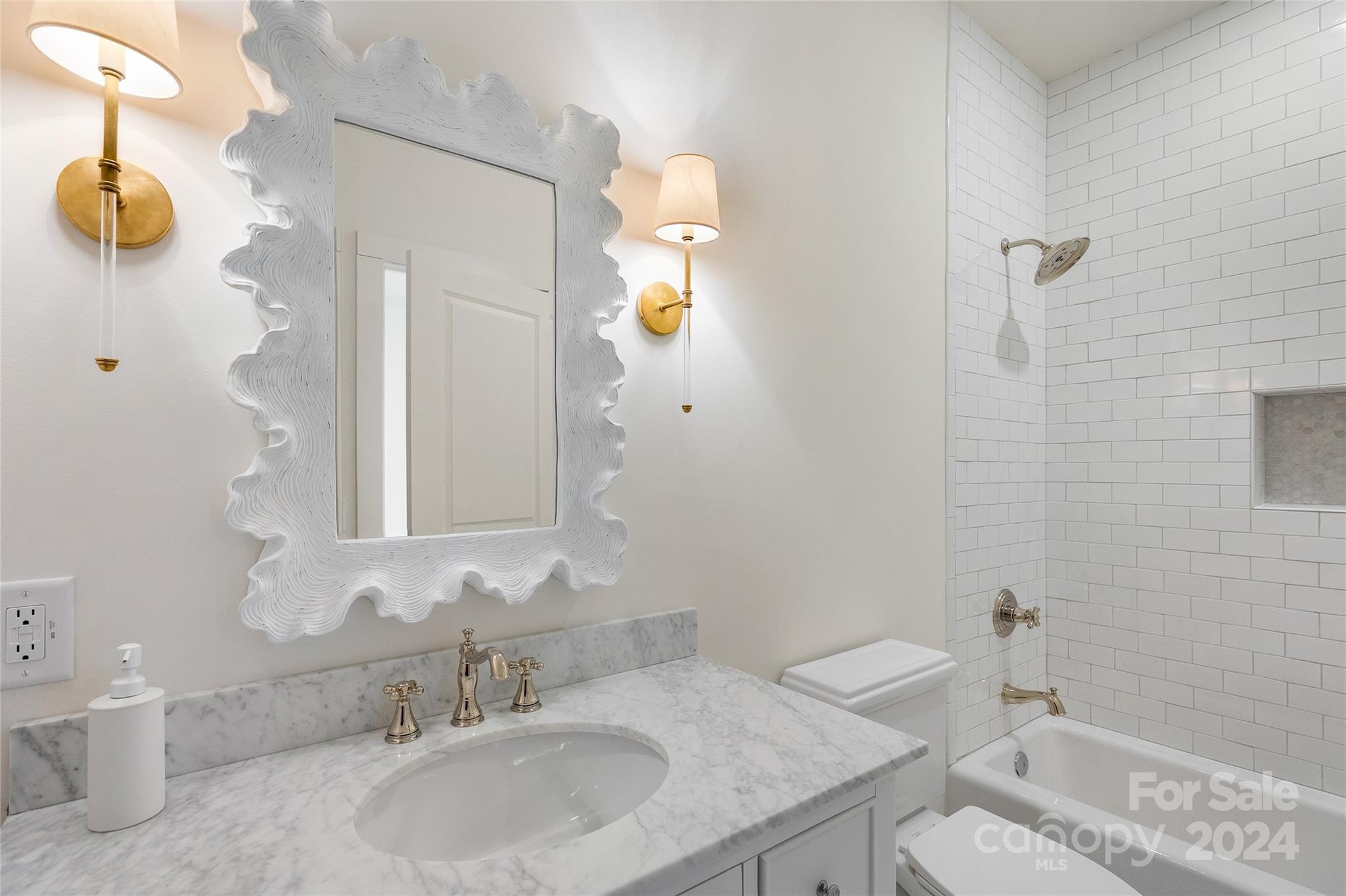 510 Boiling Springs Road Sapphire, NC 28774 - Photo 36 of 48 a bathroom with a granite countertop sink and a mirror