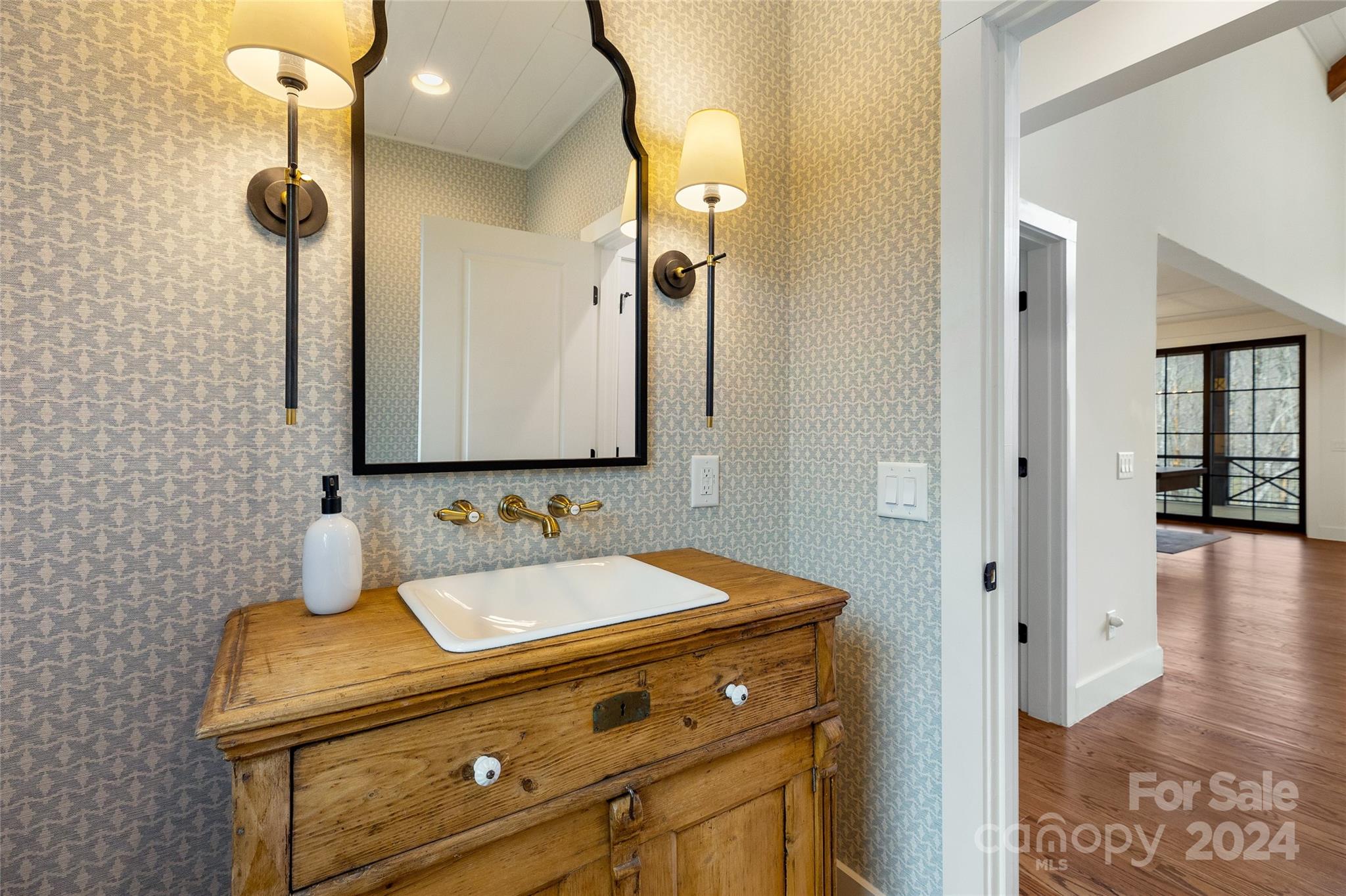 510 Boiling Springs Road Sapphire, NC 28774 - Photo 37 of 48 a bathroom with a sink and a mirror