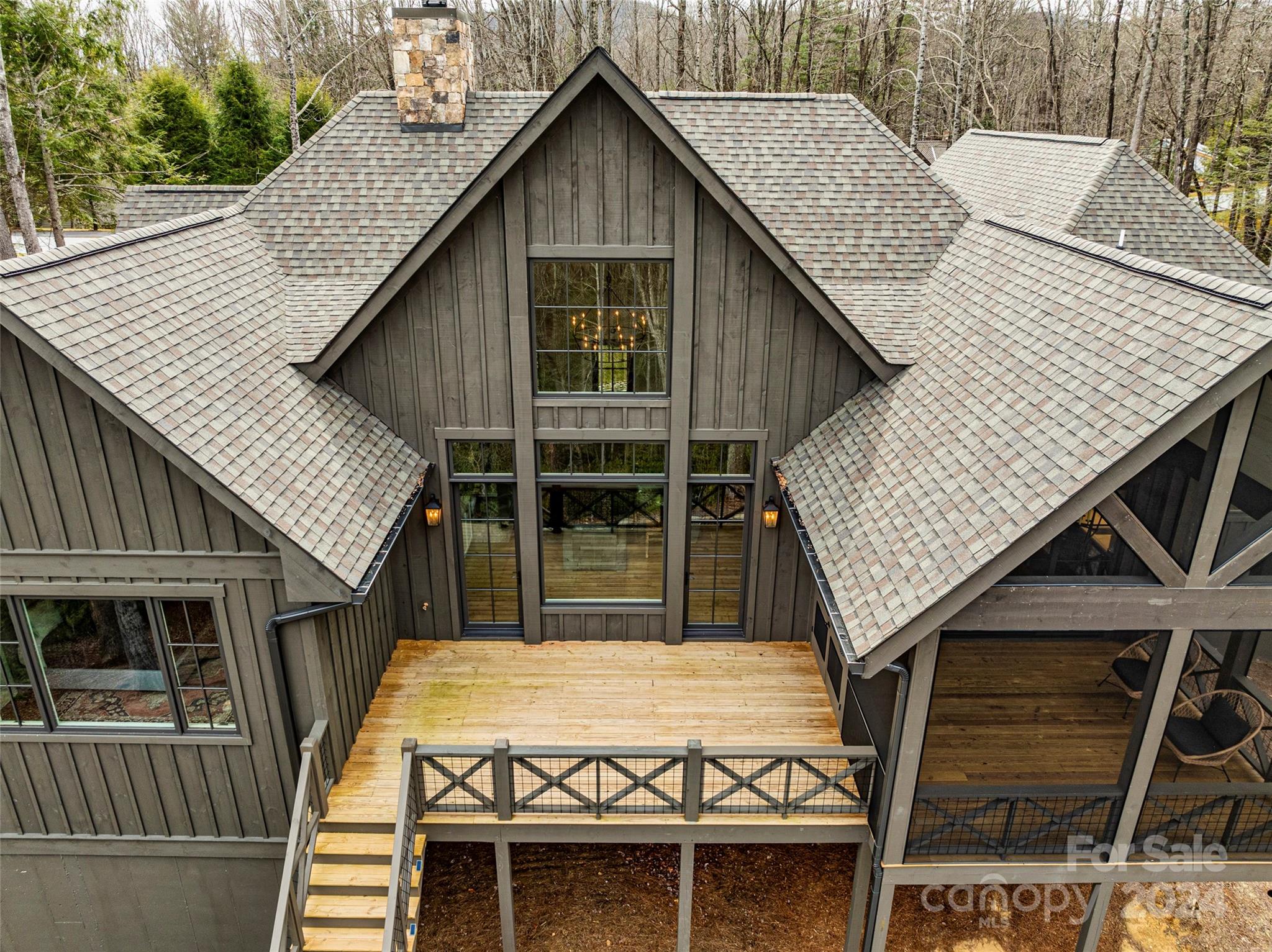 510 Boiling Springs Road Sapphire, NC 28774 - Photo 4 of 48 a view of a house with wooden deck and a garden