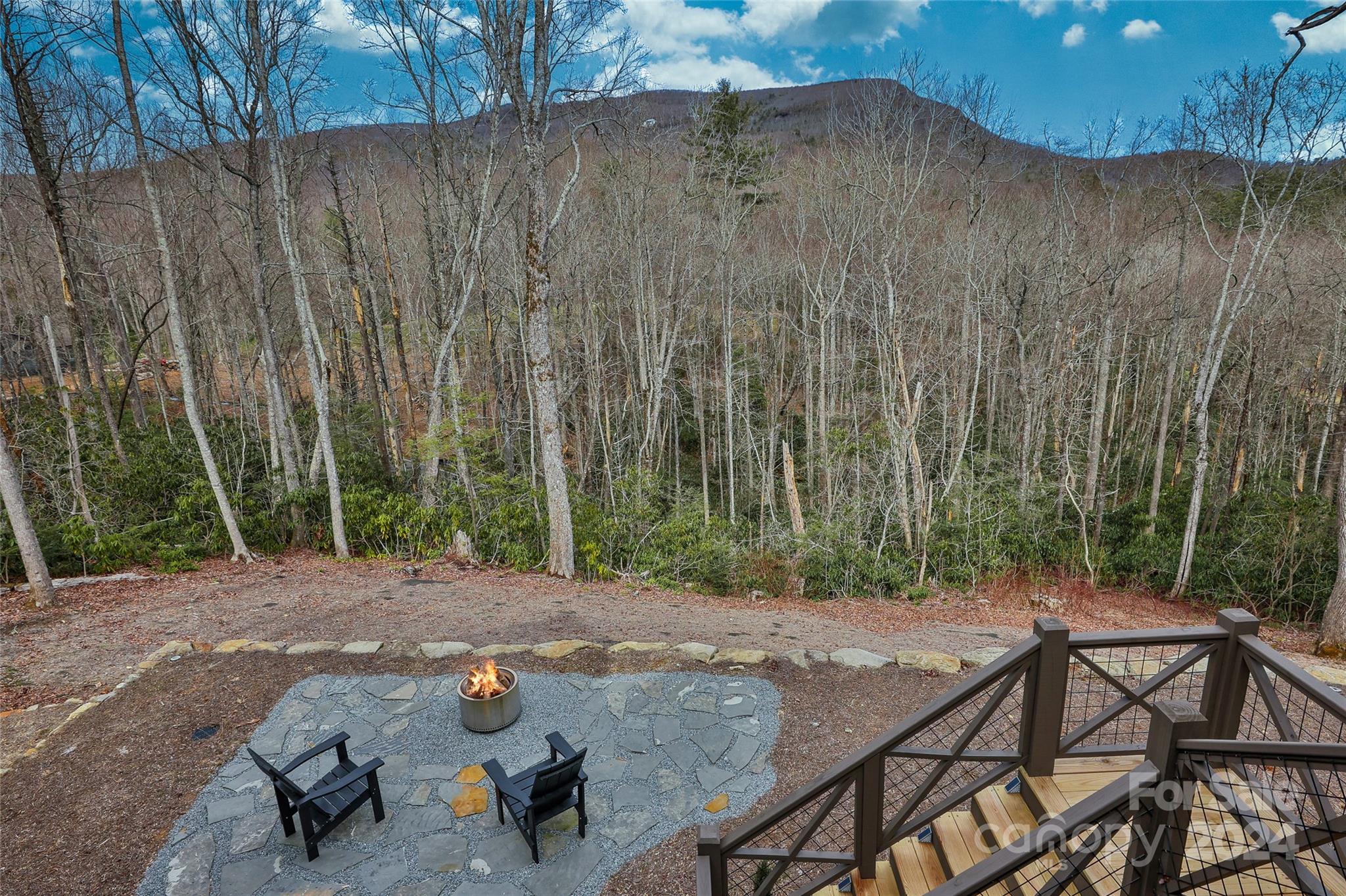 510 Boiling Springs Road Sapphire, NC 28774 - Photo 43 of 48 a view of backyard with table and chairs