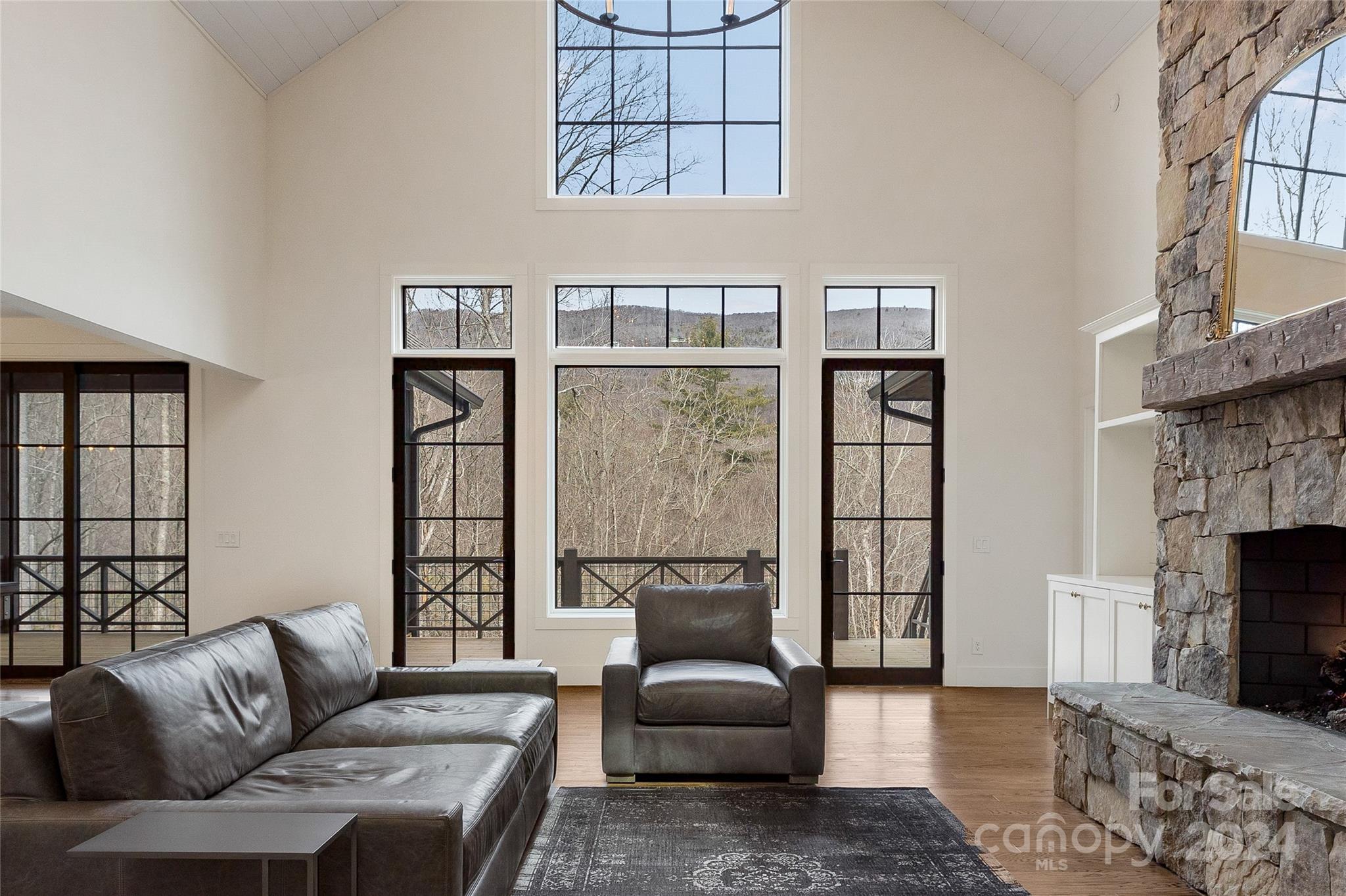 510 Boiling Springs Road Sapphire, NC 28774 - Photo 6 of 48 a living room with furniture and a fireplace
