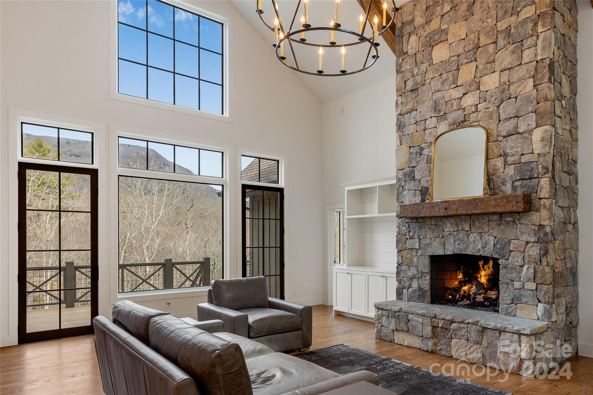 510 Boiling Springs Road Sapphire, NC 28774 - Photo 7 of 48 a living room with furniture and a fireplace