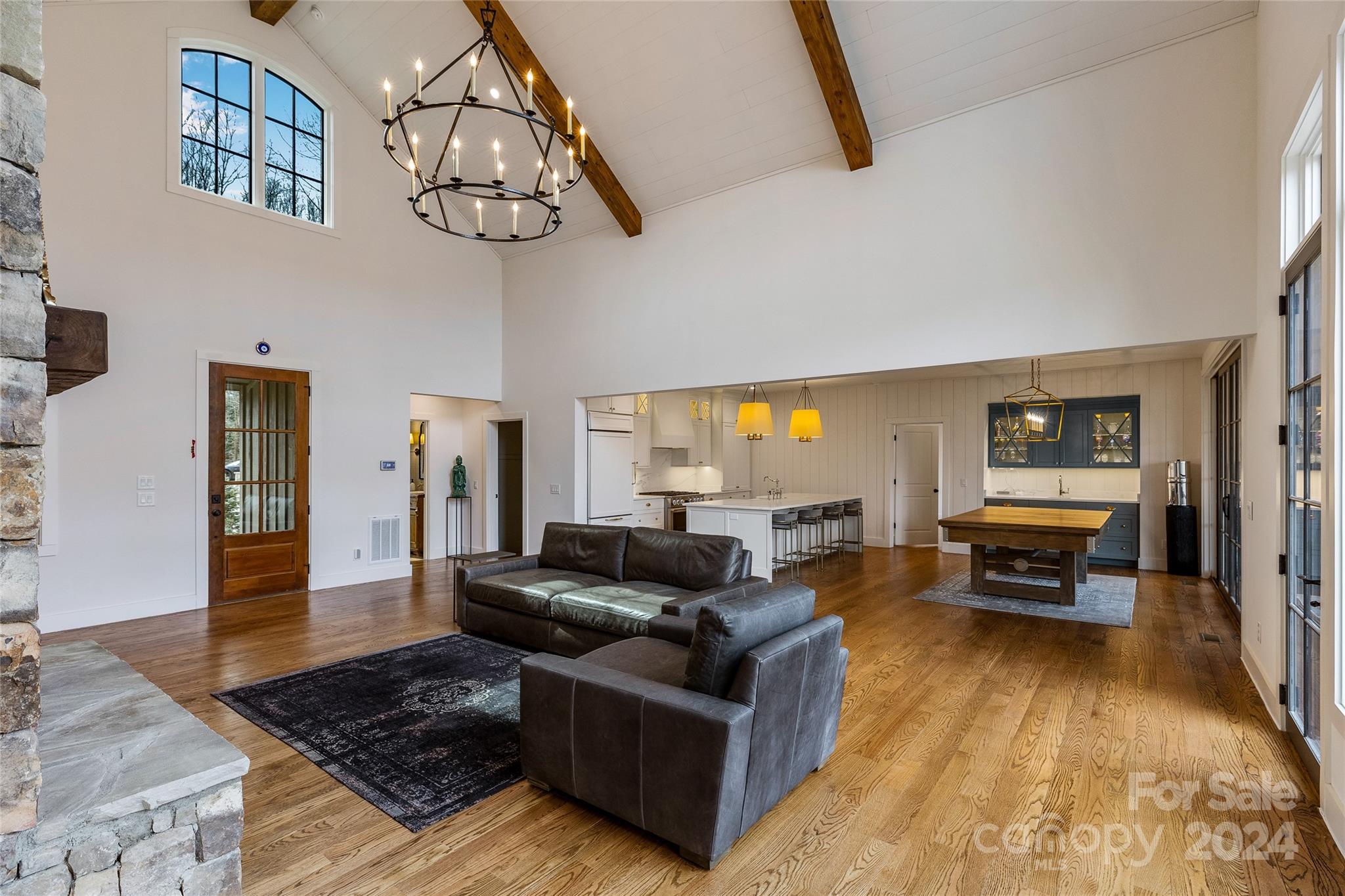510 Boiling Springs Road Sapphire, NC 28774 - Photo 9 of 48 a living room with furniture and a chandelier