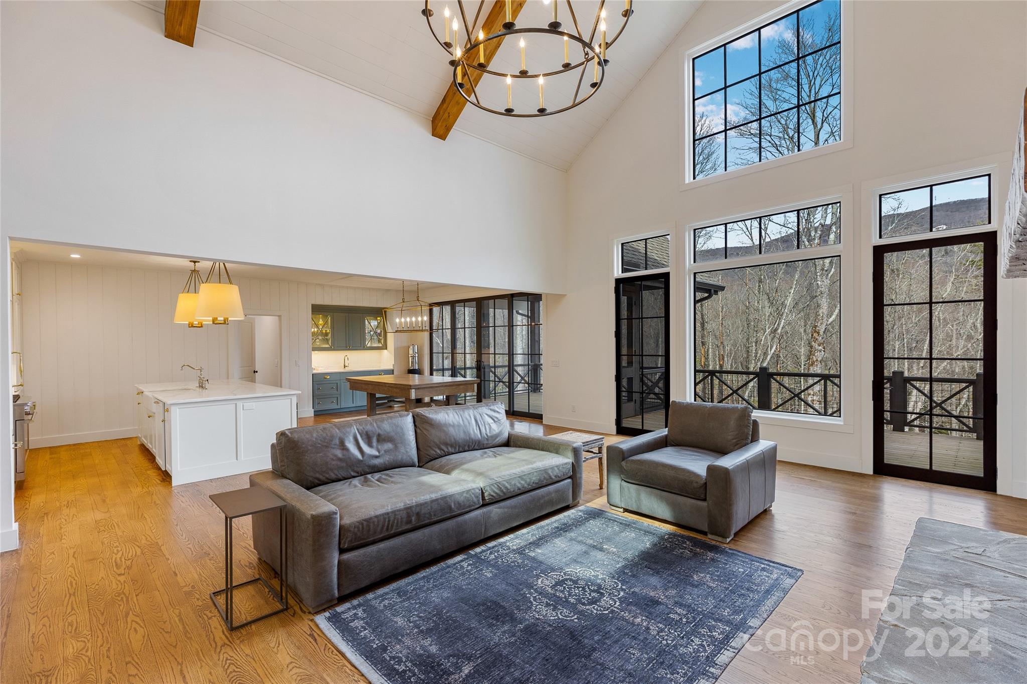 510 Boiling Springs Road Sapphire, NC 28774 - Photo 10 of 48 a living room with furniture and a large window