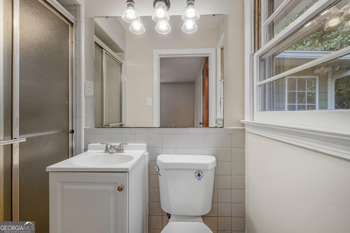 14 Mitchell Circle Rome, GA 30161 - Photo 22 of 39 a bathroom with a sink a toilet and mirror