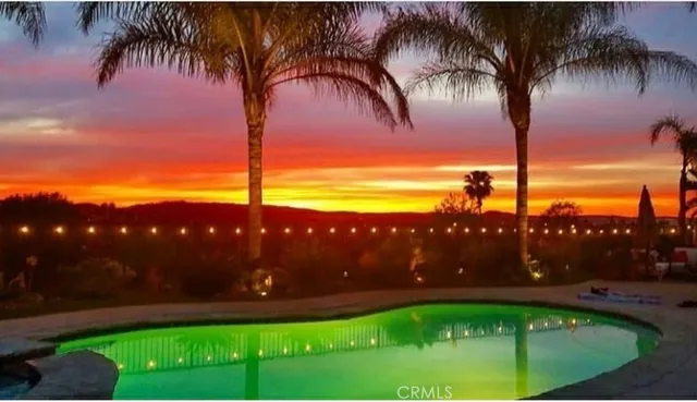 a view of swimming pool outdoor having outdoor seating
