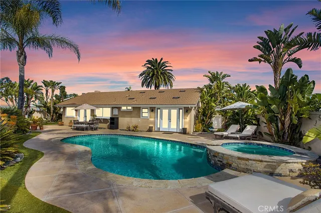 a view of a house with swimming pool and porch