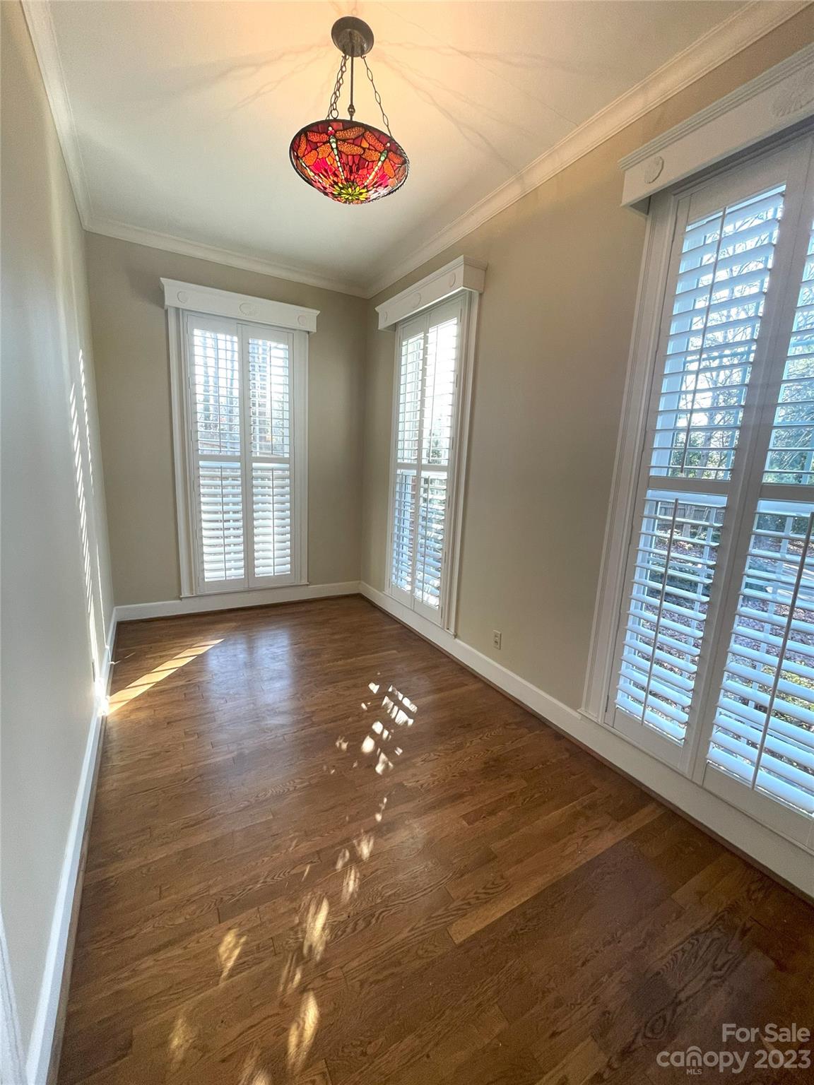 620 North 9th Street, Unit 5/6 Albemarle, NC 28001 - Photo 14 of 48 a view of an empty room with wooden floor and a window
