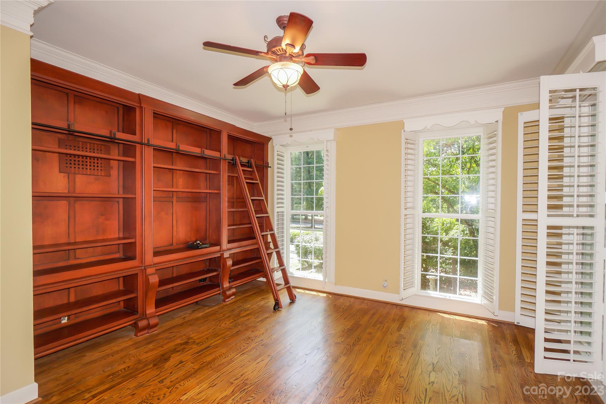 620 North 9th Street, Unit 5/6 Albemarle, NC 28001 - Photo 19 of 48 a view of an empty room with a window and wooden floor